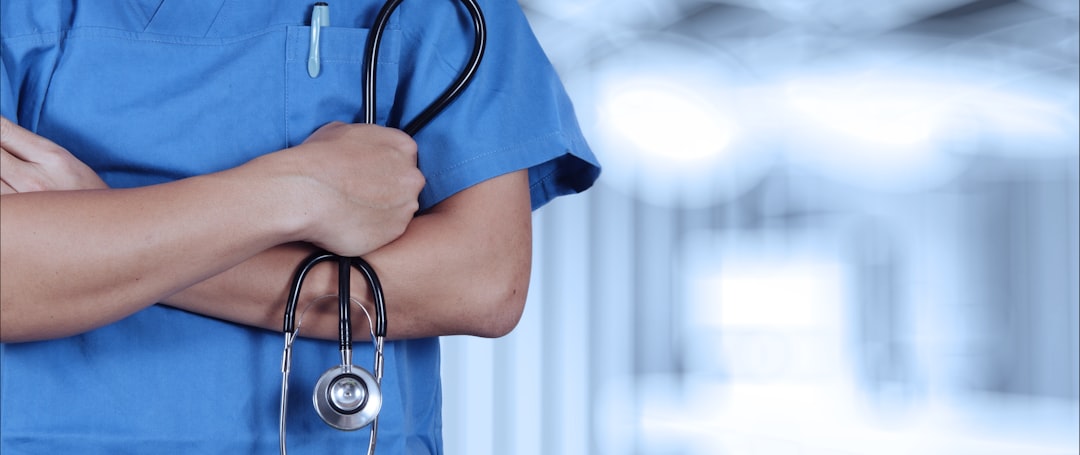a-person-in-scrubs-with-a-stethoscope-on-their-arm-1bcqaroqvxy